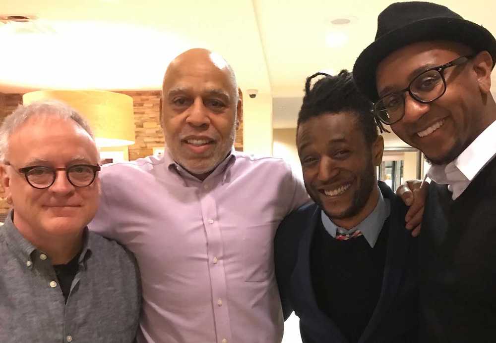 Douglas Robinson and his family smile for a photo